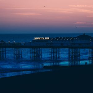 Preview wallpaper brighton, pier, beach, sunset, sea