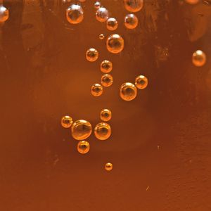 Preview wallpaper bubbles, liquid, orange, transparent