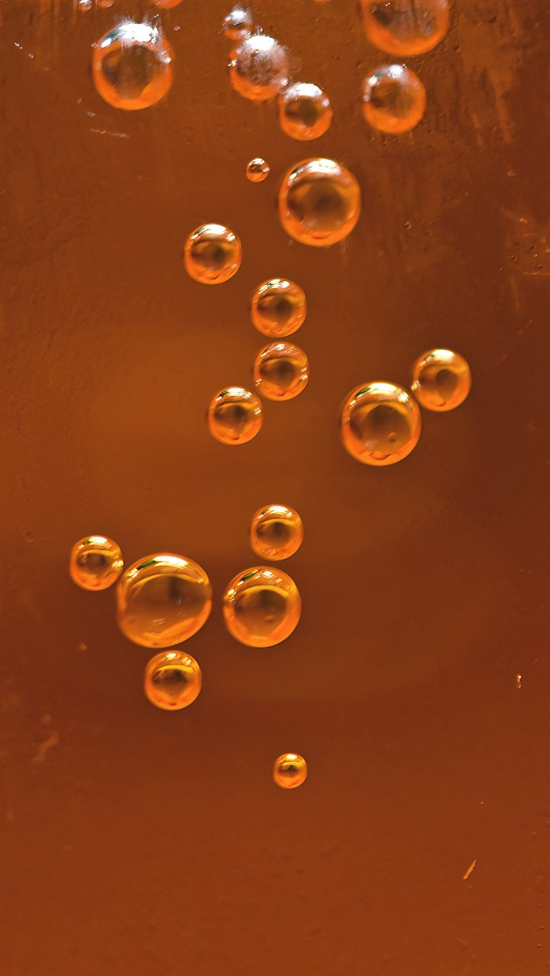 800x1420 Wallpaper bubbles, liquid, orange, transparent