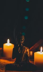 Preview wallpaper buddha, figurine, candles, buddhism, harmony