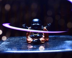 Preview wallpaper buddha, statuette, light, glare, bokeh