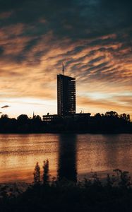 Preview wallpaper building, apartments, silhouette, sunset, river