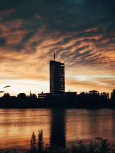 Preview wallpaper building, apartments, silhouette, sunset, river