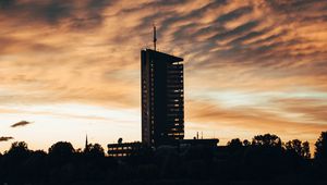 Preview wallpaper building, apartments, silhouette, sunset, river