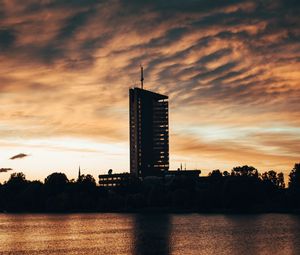 Preview wallpaper building, apartments, silhouette, sunset, river