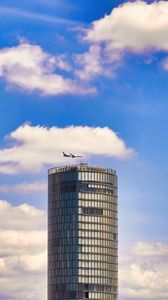 Preview wallpaper building, architecture, airplane, sky