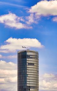 Preview wallpaper building, architecture, airplane, sky