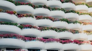 Preview wallpaper building, architecture, balconies, white, flowers