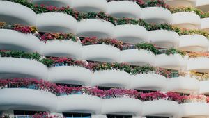 Preview wallpaper building, architecture, balconies, white, flowers