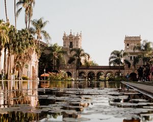 Preview wallpaper building, architecture, palm trees, pool, reflection