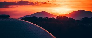 Preview wallpaper building, architecture, roof, sunset, mountains, trees
