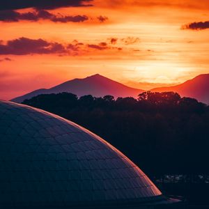 Preview wallpaper building, architecture, roof, sunset, mountains, trees