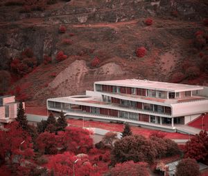 Preview wallpaper building, architecture, trees, mountain, slope