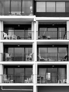 Preview wallpaper building, balconies, chairs, black and white