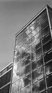 Preview wallpaper building, bars, glass, clouds, reflection, bw