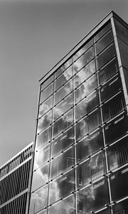 Preview wallpaper building, bars, glass, clouds, reflection, bw