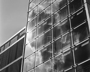 Preview wallpaper building, bars, glass, clouds, reflection, bw