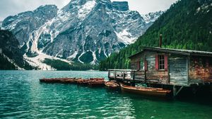 Preview wallpaper building, boat, slope, mountains