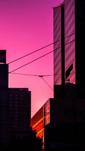 Preview wallpaper building, city, sunset, silhouette