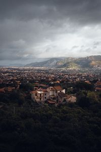 Preview wallpaper building, city, trees, mountains, distance