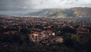 Preview wallpaper building, city, trees, mountains, distance