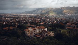 Preview wallpaper building, city, trees, mountains, distance