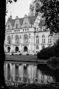 Preview wallpaper building, clock, tower, architecture, river, black and white