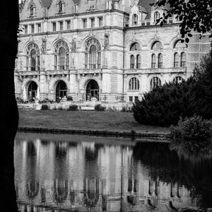 Preview wallpaper building, clock, tower, architecture, river, black and white