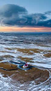 Preview wallpaper building, coast, snow, sea, aerial view