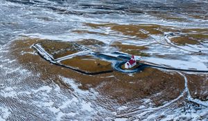 Preview wallpaper building, coast, snow, sea, aerial view