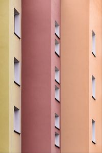 Preview wallpaper building, colorful, architecture, windows, walls, symmetry
