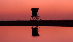 Preview wallpaper building, dark, dusk, coast, reflection