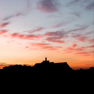 Preview wallpaper building, dark, shape, dusk, sunset