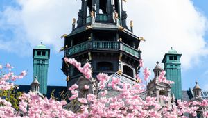 Preview wallpaper building, dome, architecture, sakura, flowers