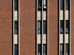 Preview wallpaper building, facade, bricks, windows, stripes