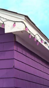 Preview wallpaper building, facade, roof, garland, purple