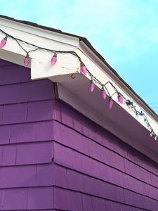 Preview wallpaper building, facade, roof, garland, purple