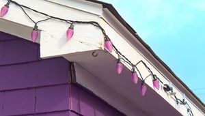 Preview wallpaper building, facade, roof, garland, purple