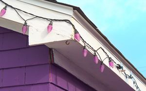 Preview wallpaper building, facade, roof, garland, purple