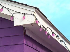 Preview wallpaper building, facade, roof, garland, purple