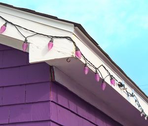 Preview wallpaper building, facade, roof, garland, purple