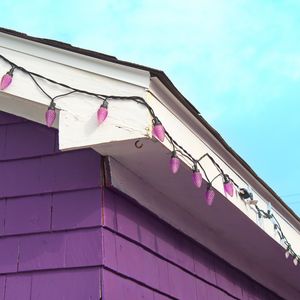 Preview wallpaper building, facade, roof, garland, purple