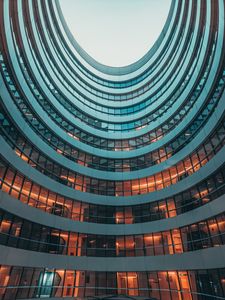 Preview wallpaper building, facade, round, glassy, sky