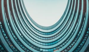 Preview wallpaper building, facade, round, glassy, sky