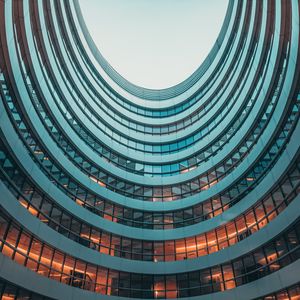 Preview wallpaper building, facade, round, glassy, sky