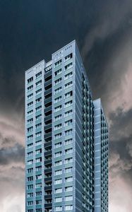 Preview wallpaper building, facade, skyscraper, clouds, cloudy