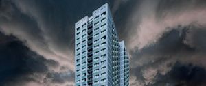 Preview wallpaper building, facade, skyscraper, clouds, cloudy
