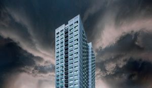 Preview wallpaper building, facade, skyscraper, clouds, cloudy