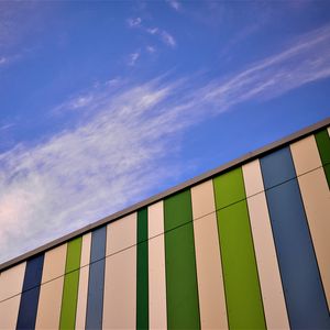 Preview wallpaper building, facade, stripes, clouds