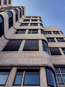 Preview wallpaper building, facade, windows, architecture, waves